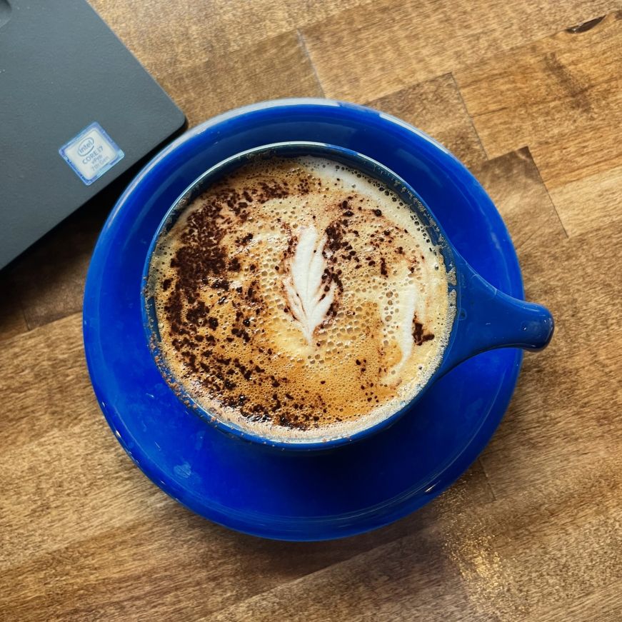 Top down view of a cappuccino with foam art