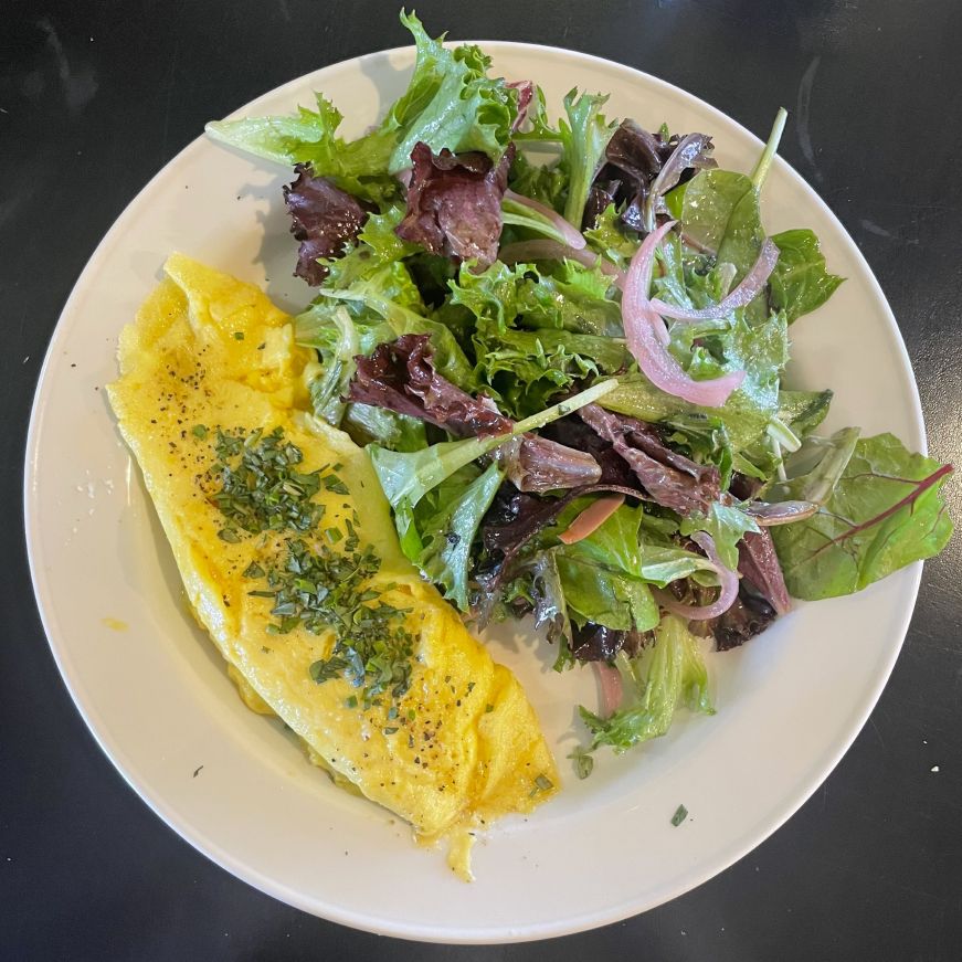 French omelette with greens on the side