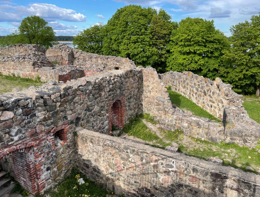 Partial stone walls with grassy areas in between