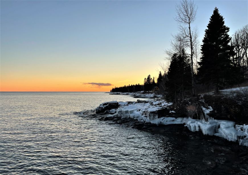 Sunset over Lake Superior shoreline 