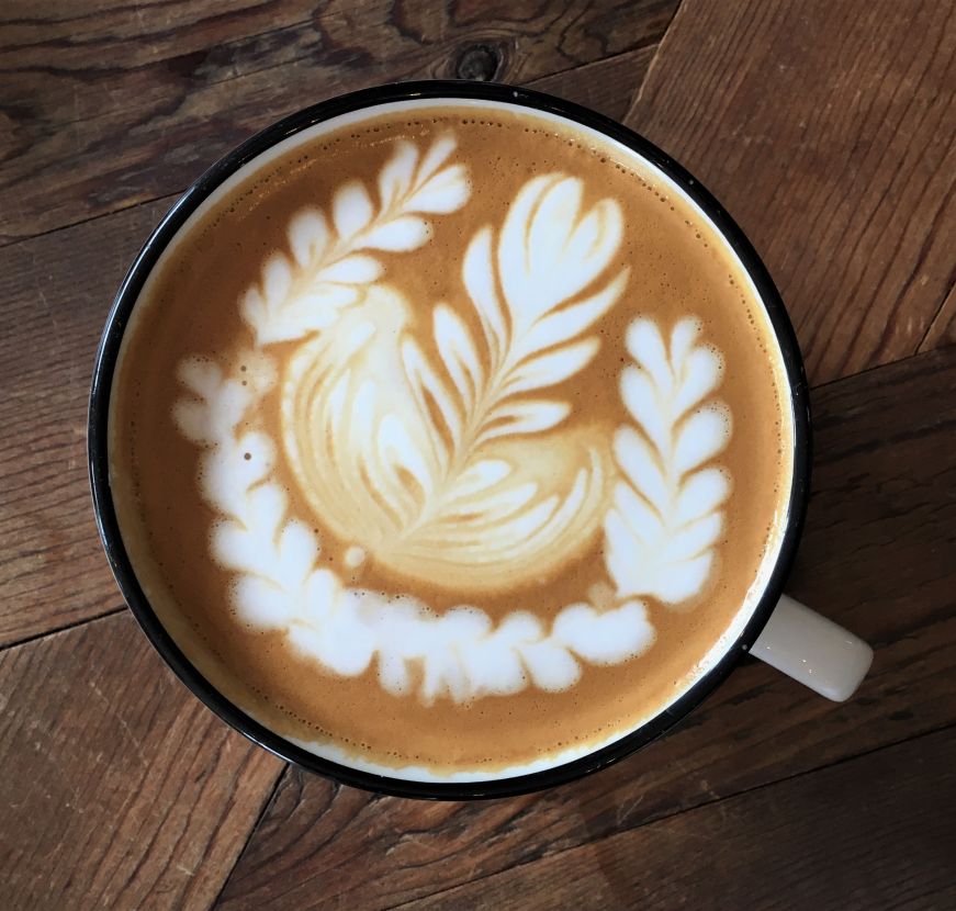 Latte with an elaborate floral design in the foam, Splitlog Coffee Co., Kansas City, Kansas