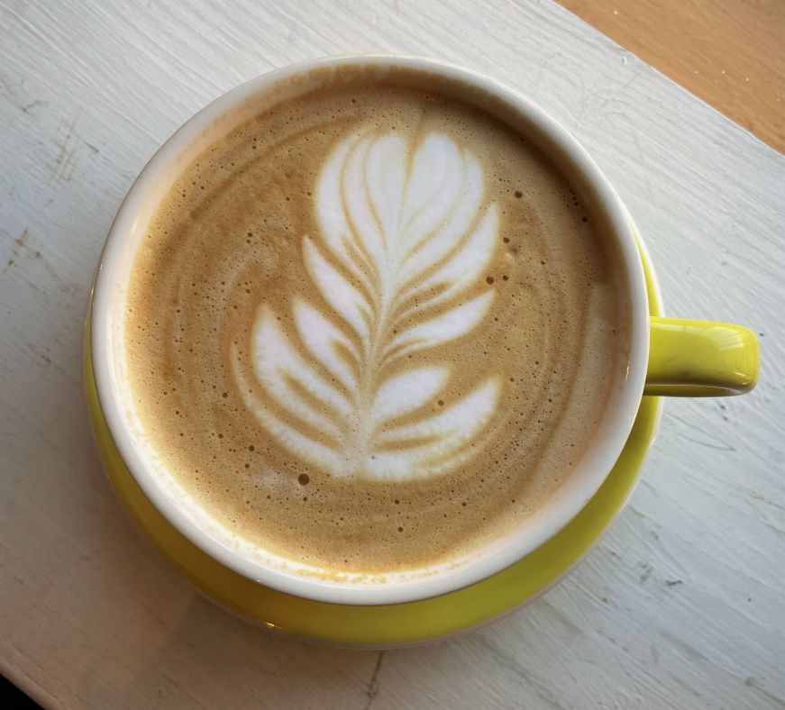 Top down view of a latte with latte art