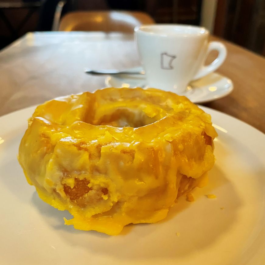 Bright yellow old fashioned donut