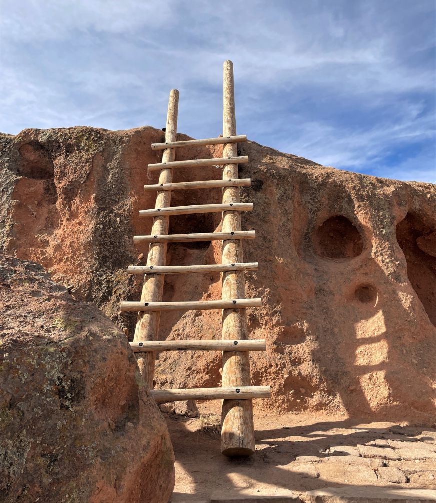 Wooden ladder leaned against a cliff