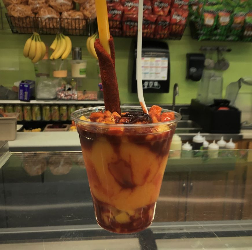 Mangoneada Especial mango sorbet sundae on counter at Paleterias Tropicana, Kansas City