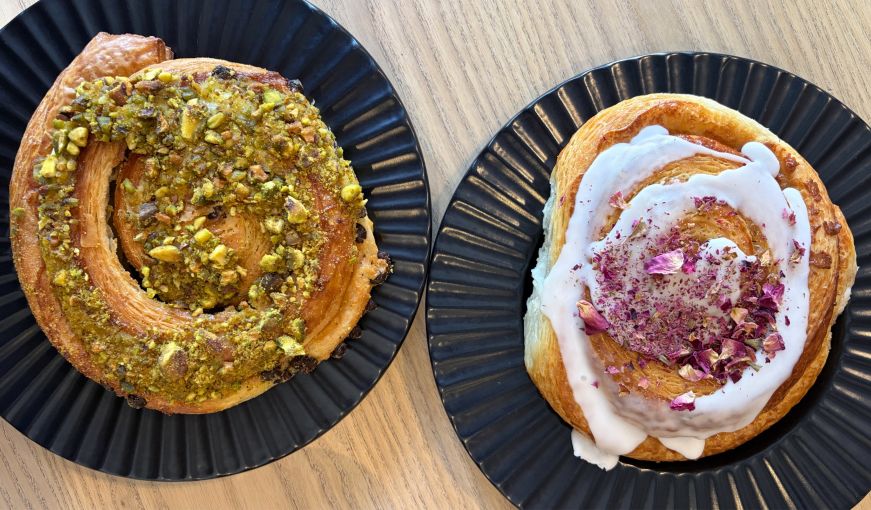Pastries topped with pistachios and rose petals