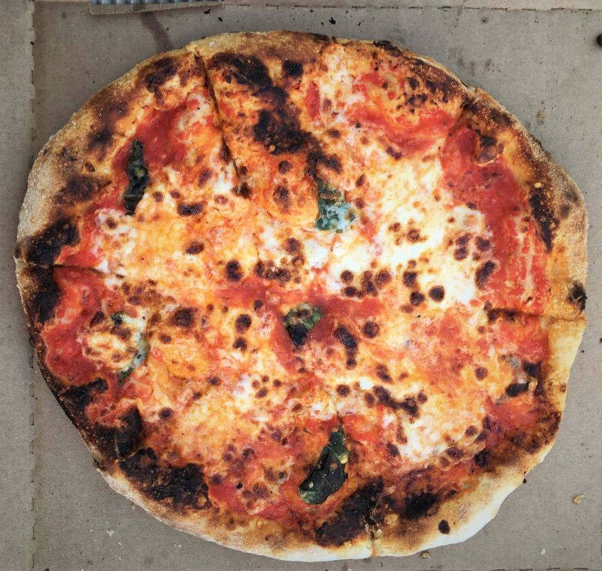 Top down view of margherita pizza in box