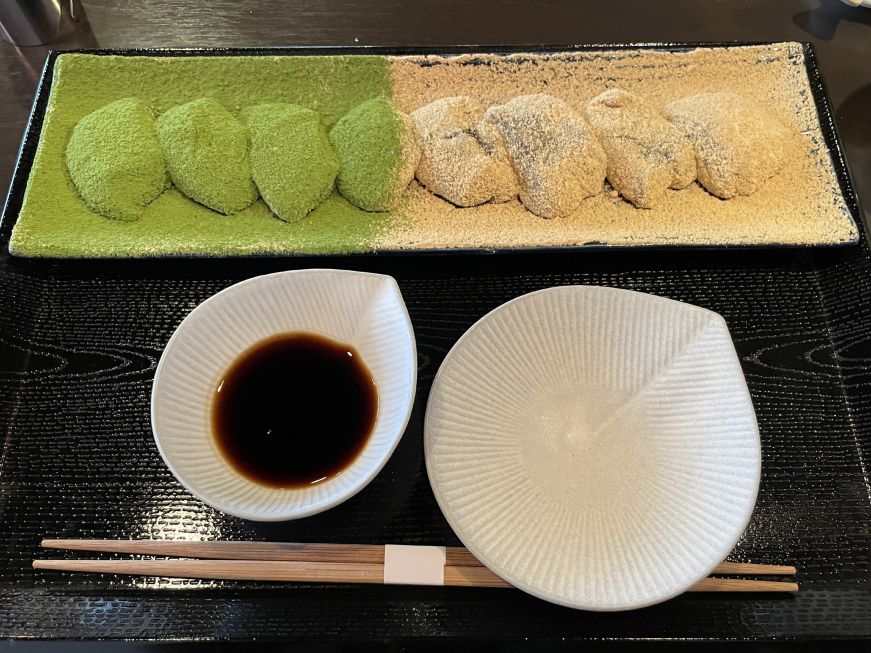 Plate of warabimochi dusted with matcha powder and soy powder