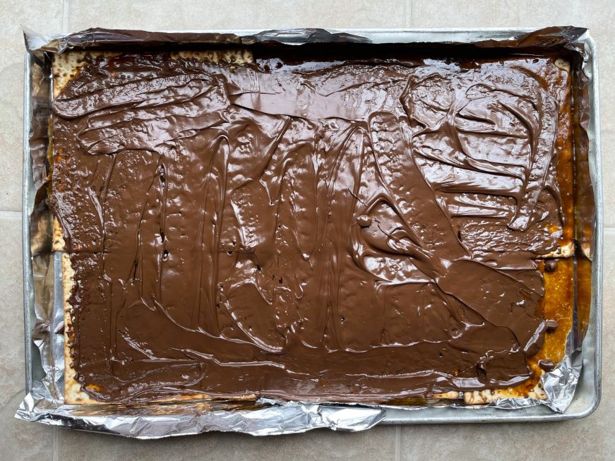 Pan of matzah toffee before chilling