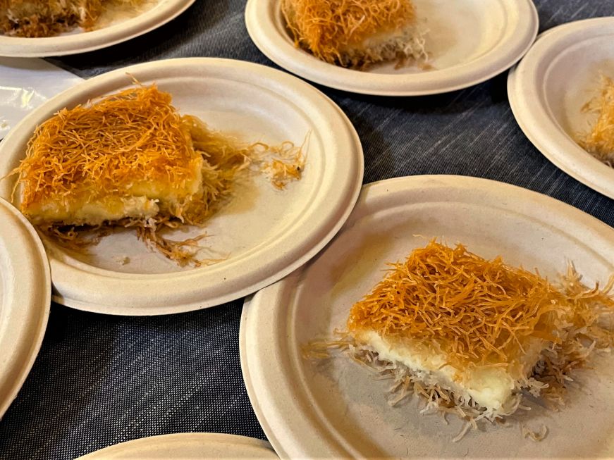 Several plated portions of a dessert topped with shredded pastry dough