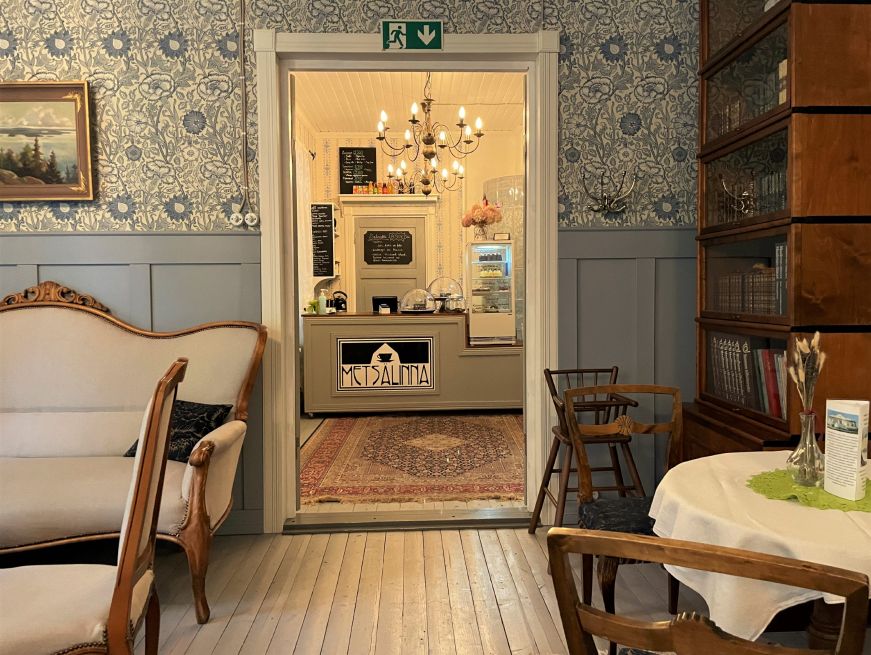 Victorian interior with a cafe counter and bakery case