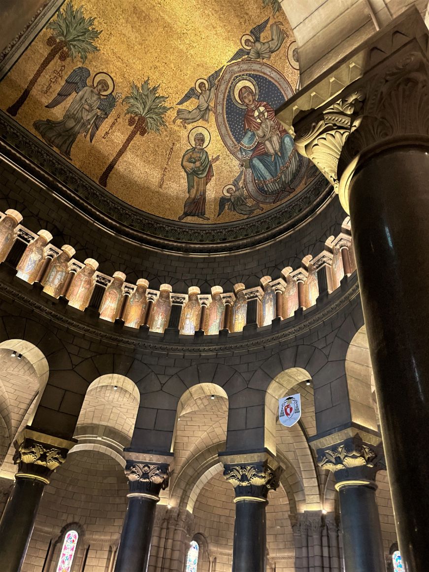 Church ceiling decorated with an elaborate mosaic with a gold background