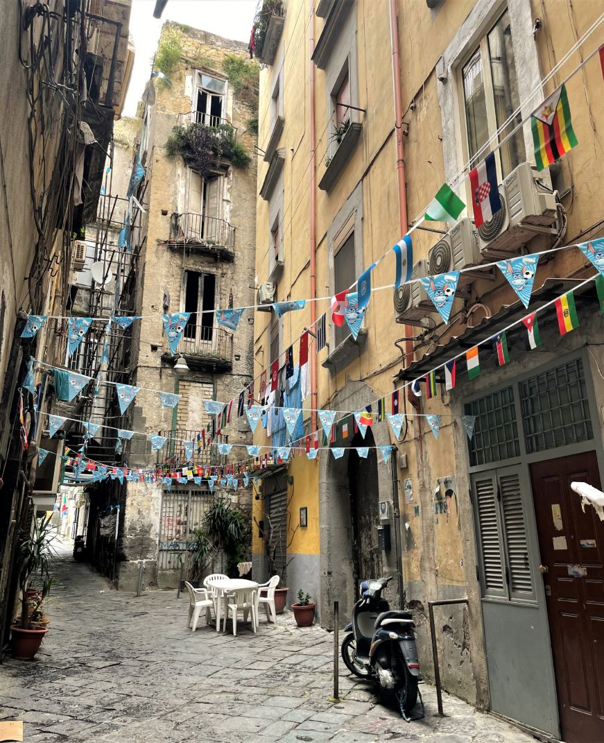 Narrow alley with streamers overhead 