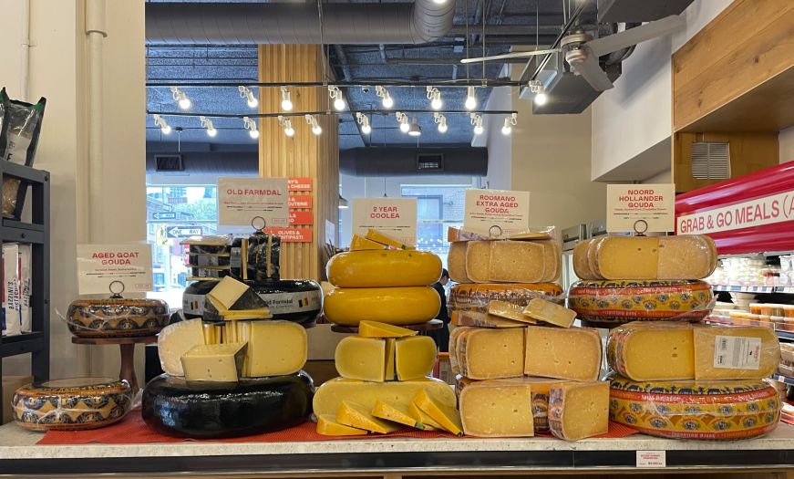 Display of large wheels of gouda cheese