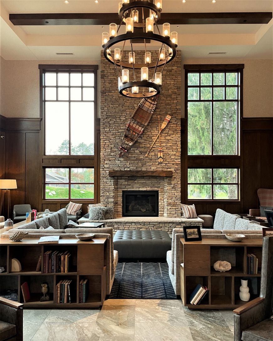 Upscale hotel lobby with a large stone fireplace
