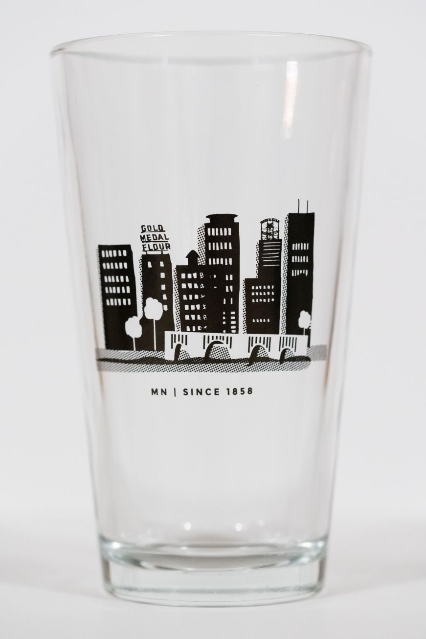 Pint glass with an image of the Minneapolis skyline