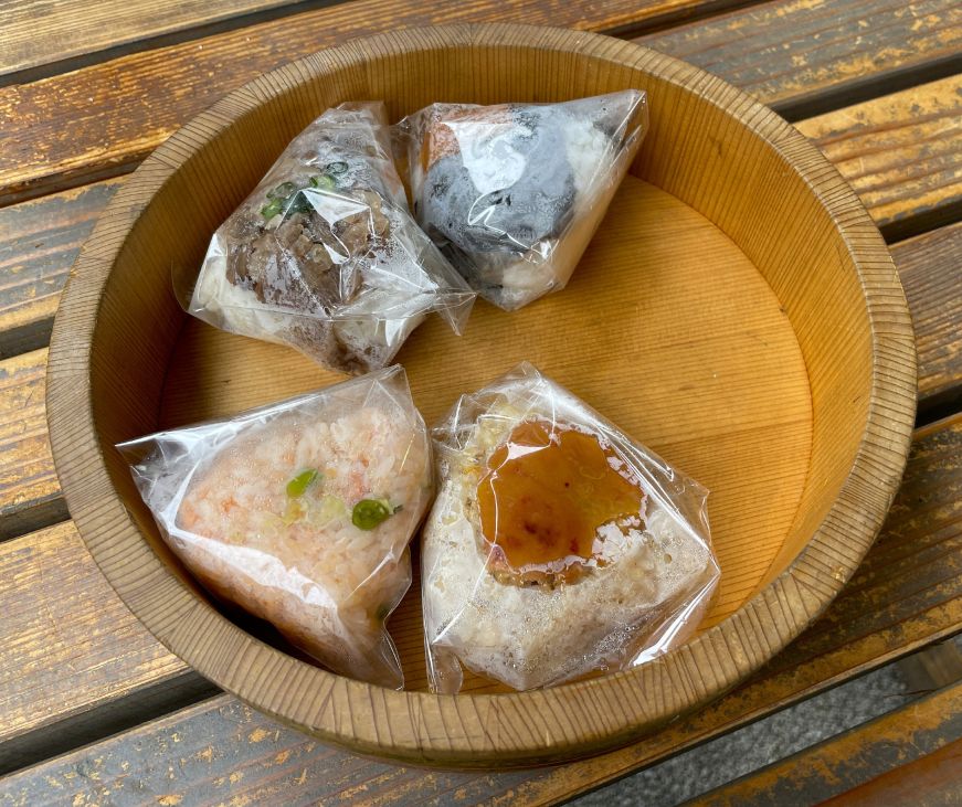 Wooden tray with four onigiri