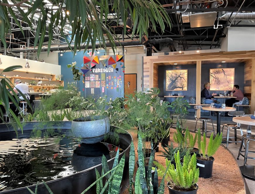Restaurant interior decorated with potted plants