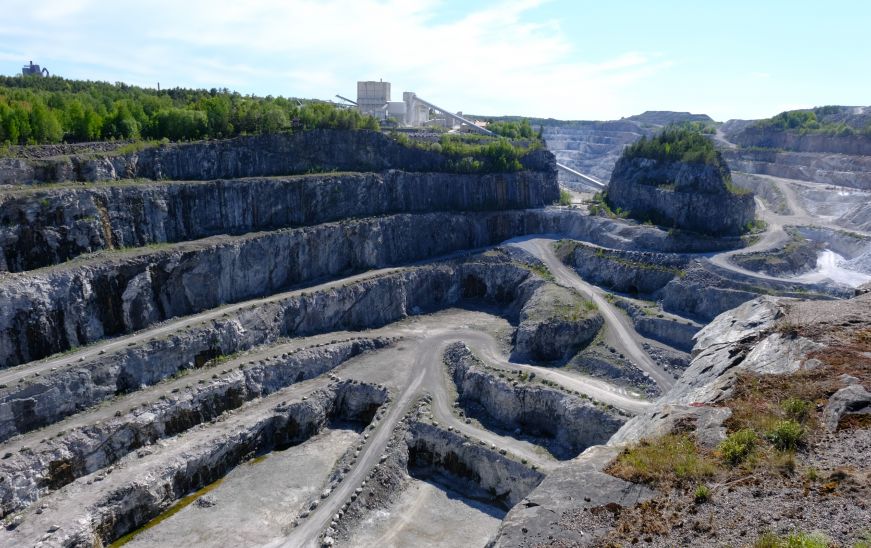 Quarry pit with white terraced excavation