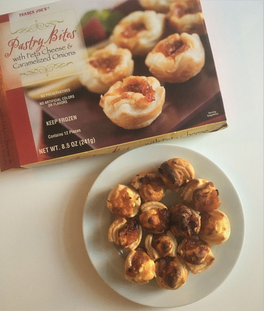 Pastry bites with feta cheese and caramelized onion, Trader Joe's Plate of pastry bites with feta cheese and caramelized onion and product packaging
