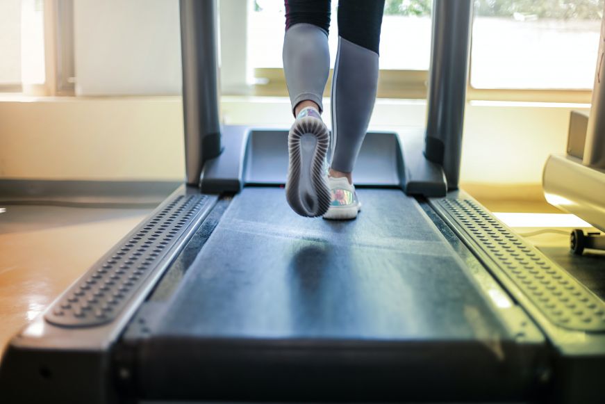 Feet running on a treadmill