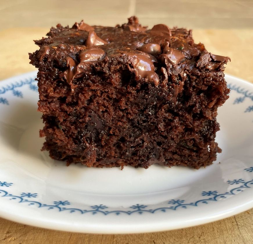 Square piece of chocolate cake on a plate