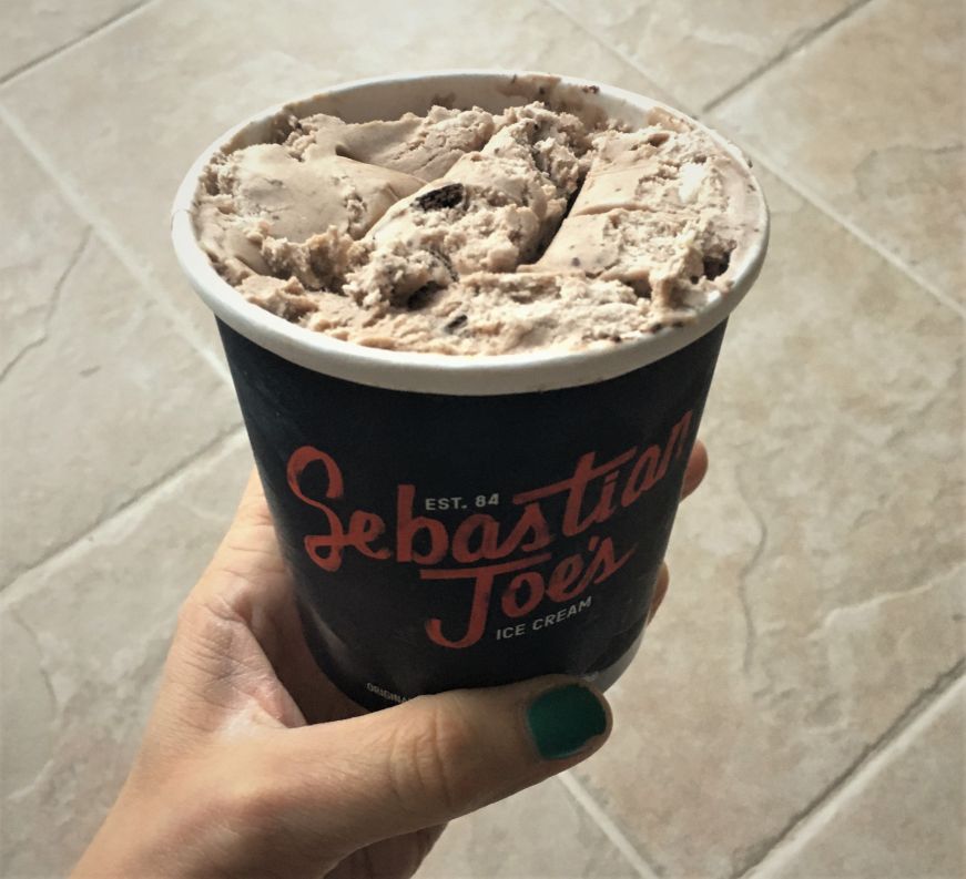 Oreo ice cream, Sebastian Joe's Hand holding pint of Oreo ice cream