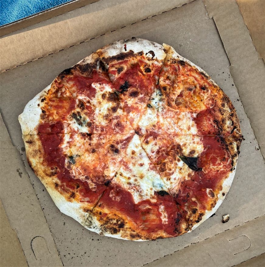 Margherita pizza in a cardboard pizza box