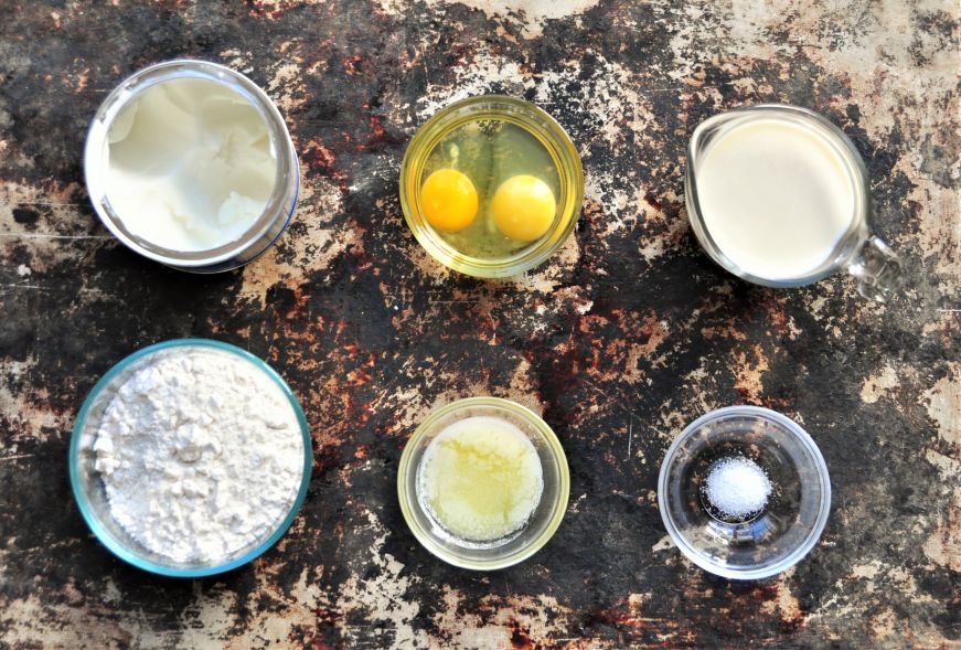 Popover ingredients arranged on a baking sheet