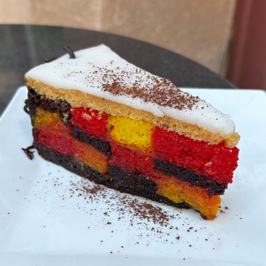 Piece of cake with a red, yellow, and brown checkerboard pattern