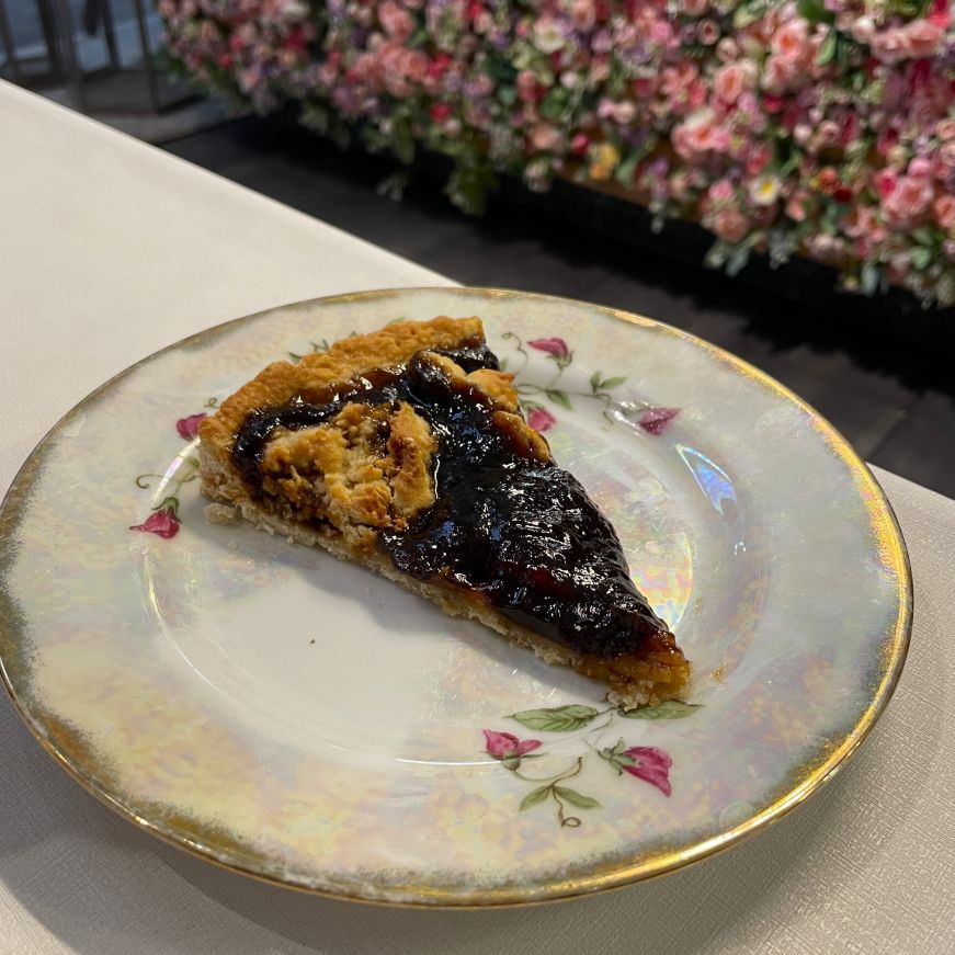 Rhubarb cake, Freya Café Slice of rhubarb jam tart on a china plate