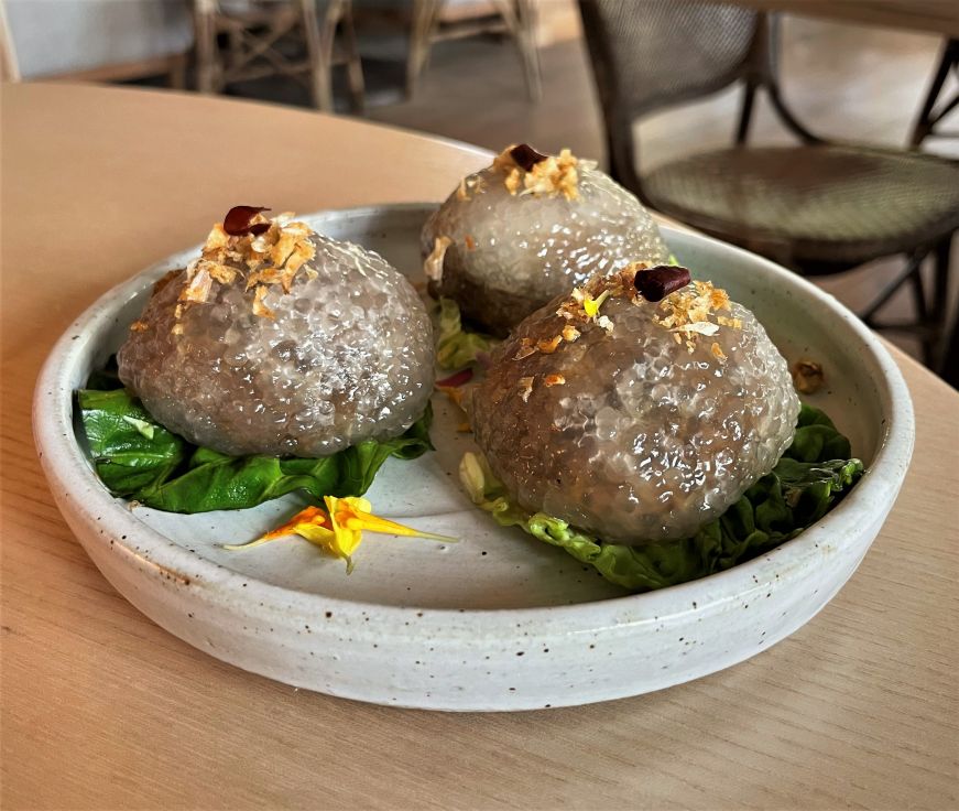 Plate of three dumplings made from tapioca pearls