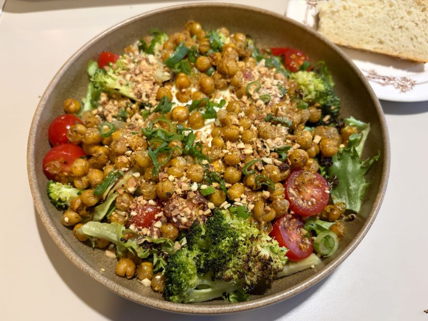 Salad with lettuce, broccoli, tomatoes, and crispy chickpeas