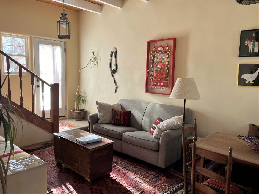 Living room in a Pueblo Revival-style home decorated with folk art