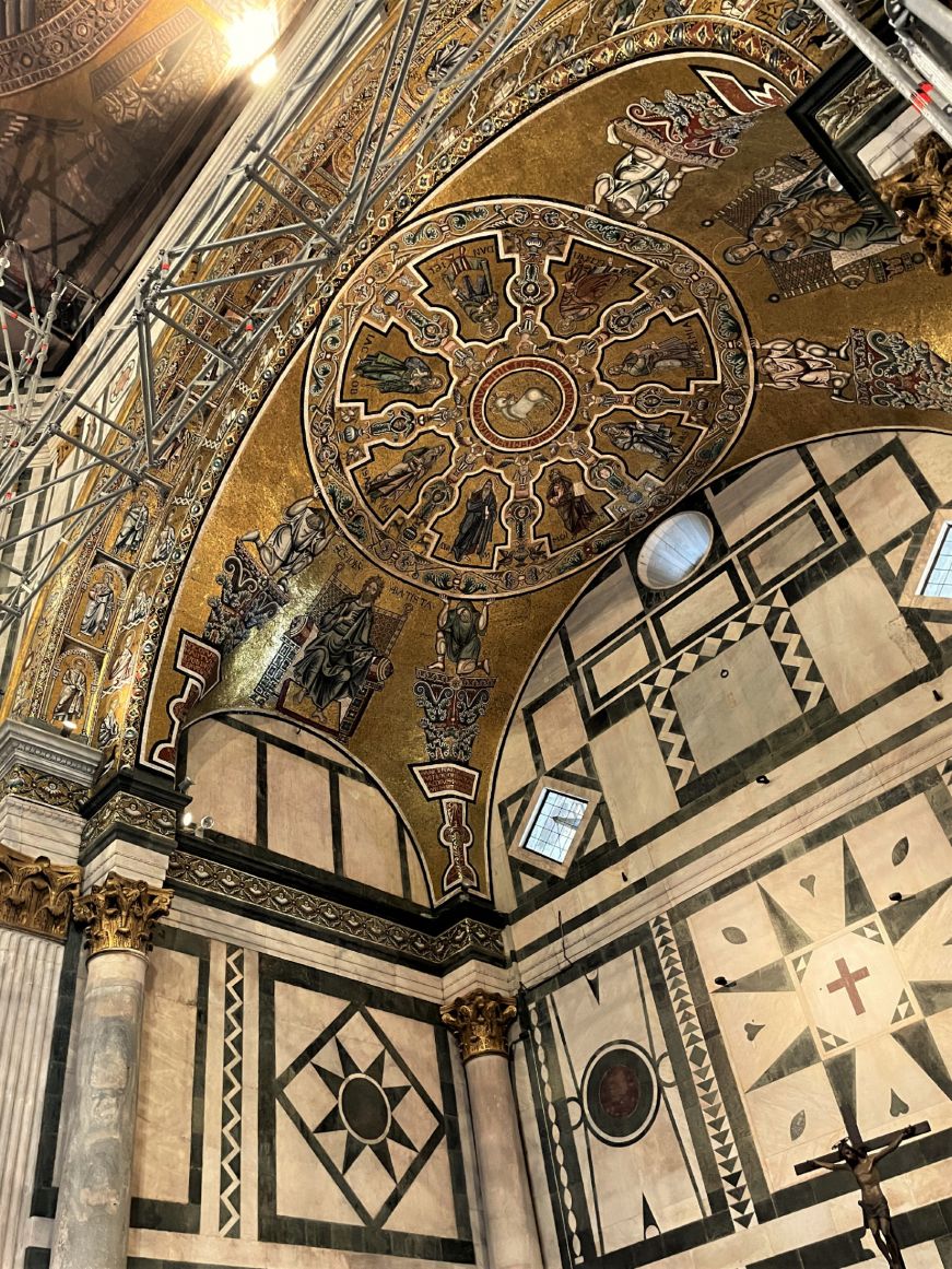 Ceiling decorated with an elaborate mosaic of religious figures with a gold background