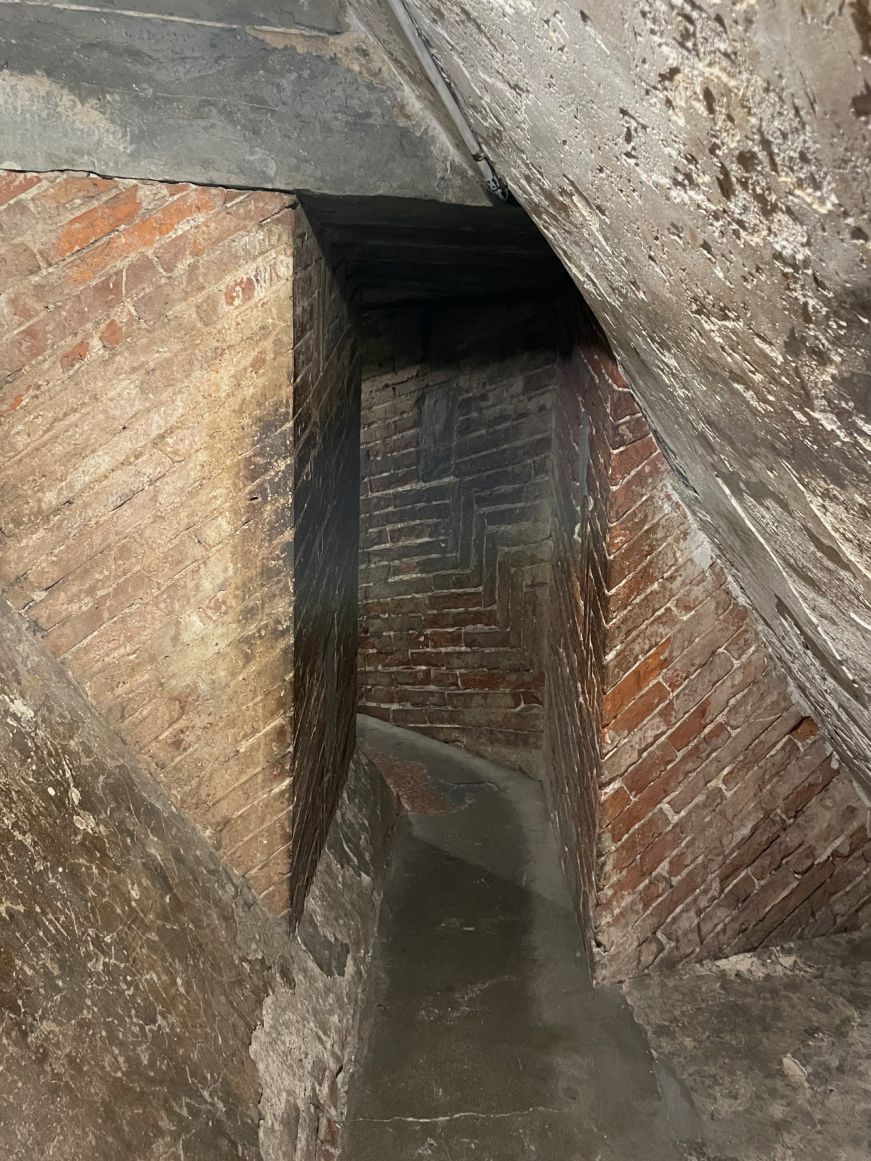 Santa Maria del Fiore dome climb Narrow, steep brick passageway with a low ceiling
