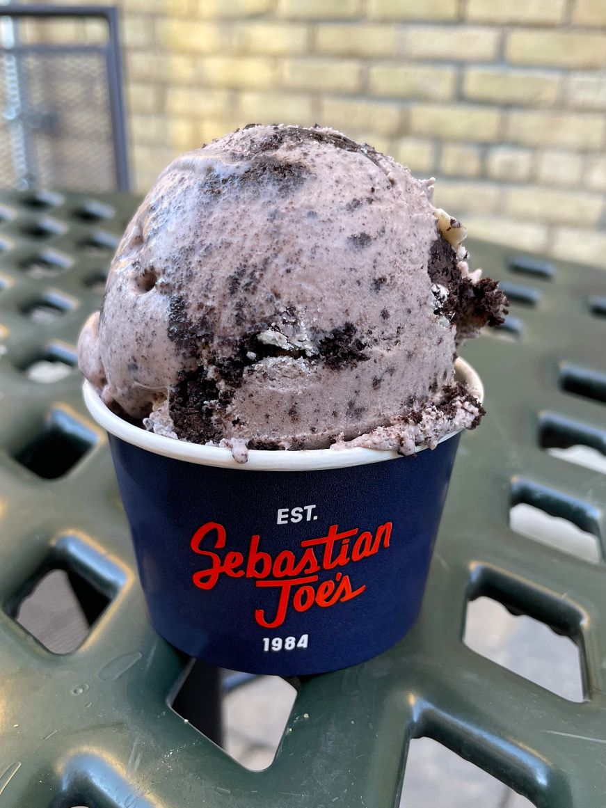 Sebastian Joe's Oreo ice cream Large scoop of Oreo ice cream in a cup reading "Sebastian Joe's established 1984"