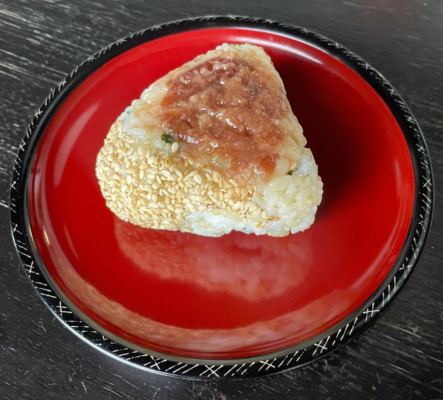 Sesame, shiso, and plum onigiri on a plate