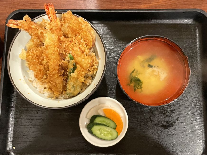Tempura rice bowl set meal at Amairo, Tokyo Tray with a bowl of rice and tempura, a bowl of miso soup, and a small dish of pickles