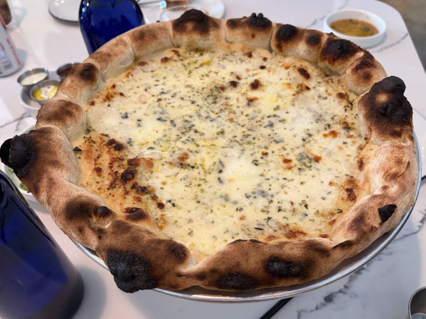 Cheese pizza with a charred crust