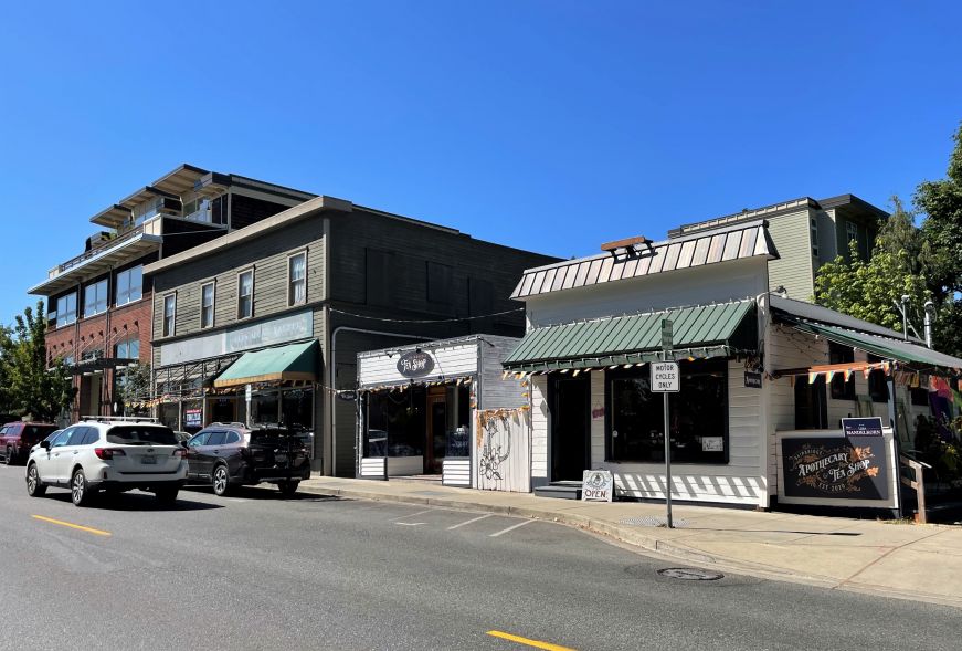 Storefronts along a two-lane street