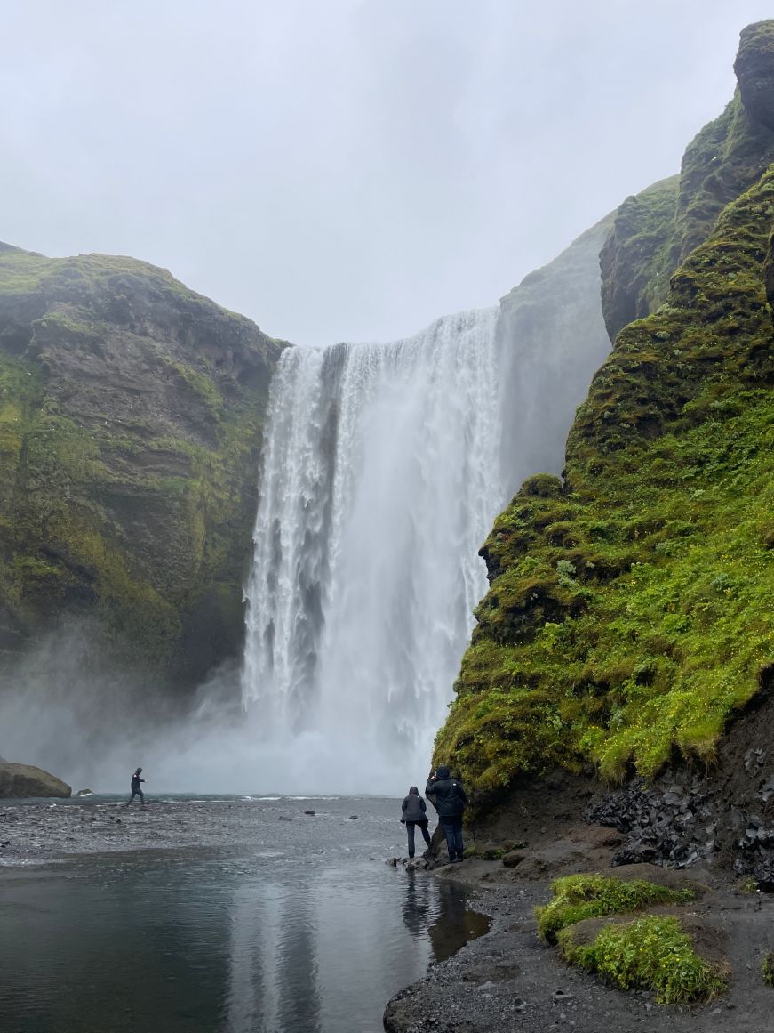 Skógafoss, Iceland Large waterfall surrounded by mossy cliffs