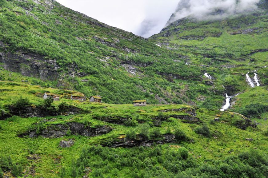 Sod  roof houses and waterfall, Geiranger