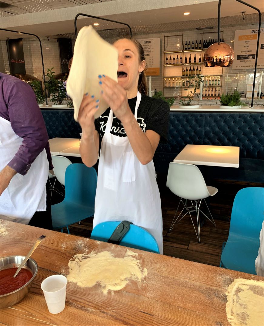Stacy trying to toss pizza dough with a look of horror on her face, 1889 Pizza Napoletana, Kansas City, Kansas