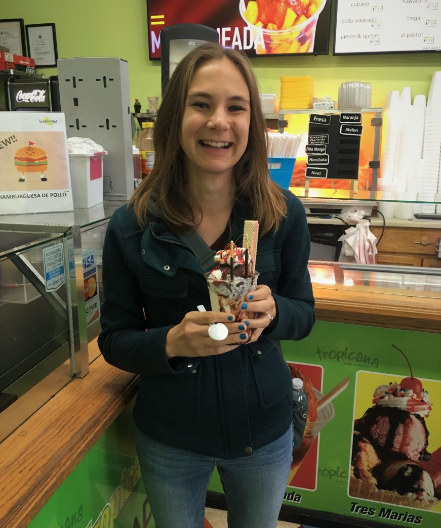 Stacy holding an ice cream sundae at Paleterias Tropicana, Kansas City