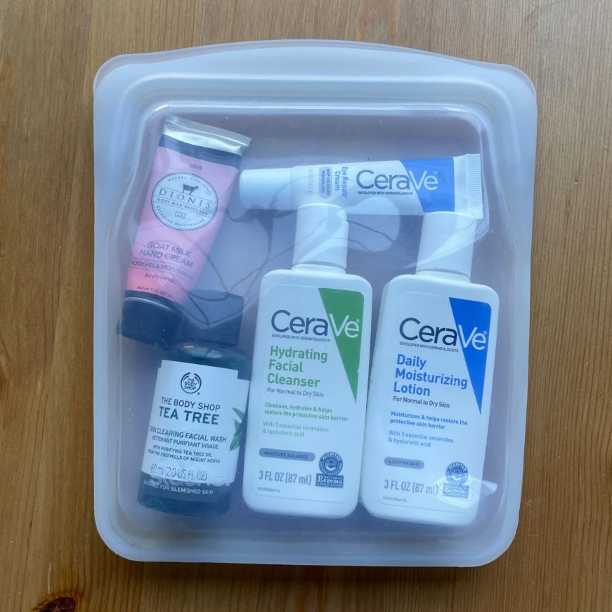 Clear silicon bag filled with travel-size toiletry products