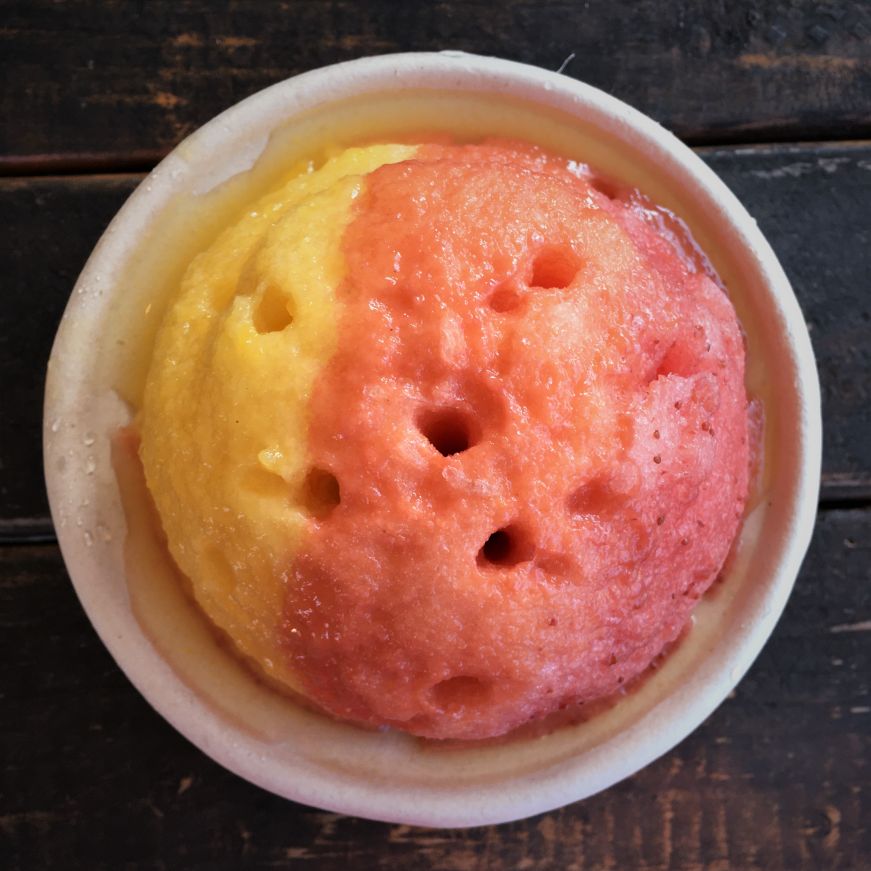 Cup of shave ice with mango, guava, and strawberry syrup, Kula Shave Ice, Hilo, Hawaii