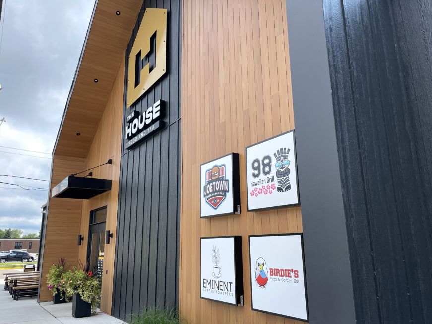 The House Food and Tap exterior with signs for individual stalls 
