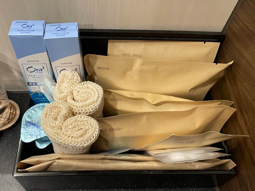 Toiletries at Sora Niwa Terrace Kyoto Box with toiletries on a hotel bathroom counter