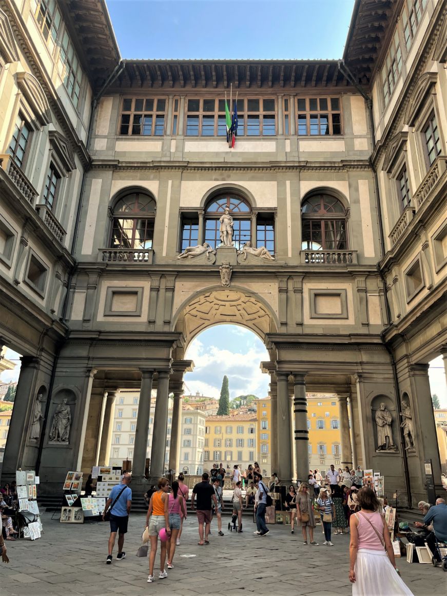 Ornate courtyard with crowd of people 